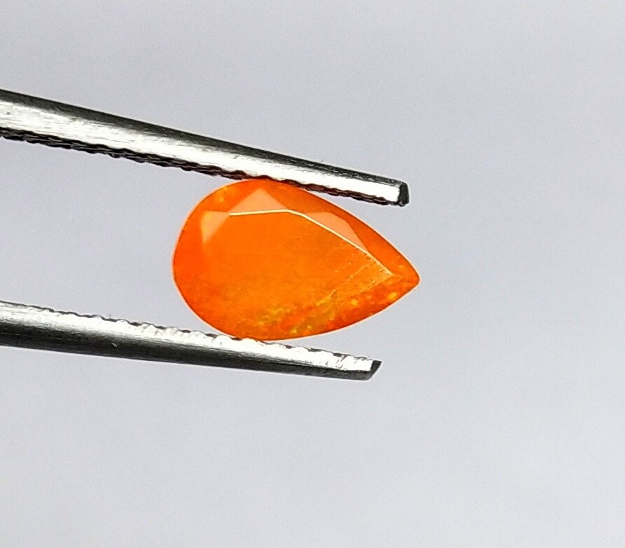 AAA+ Natural Ethiopian Opal Faceted Pear Shape 0.45 Cts Multi Fire Orange Opal