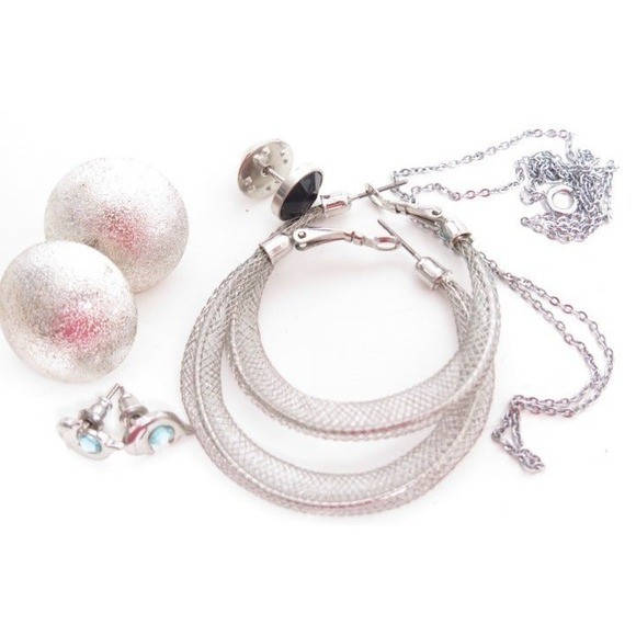 Silver plated and silver toned jewelry lot has 4 pairs