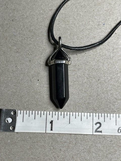 Black Tourmaline Pendant hanging from a 16″ Leather Cord with a 2′ extender