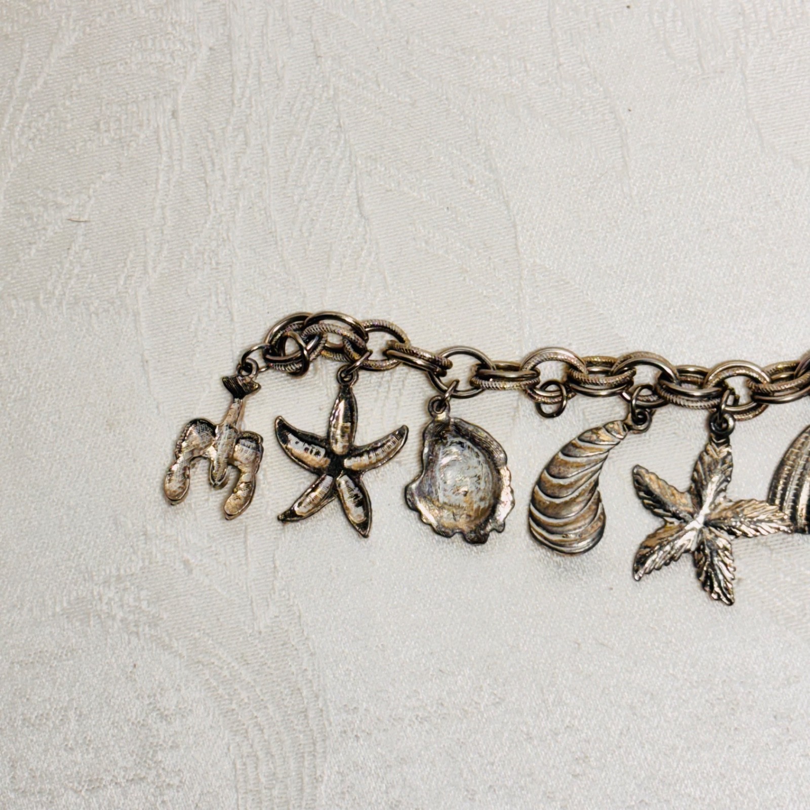 BRACELET ocean life charms starfish shells fish lobster fold over clasp vintage