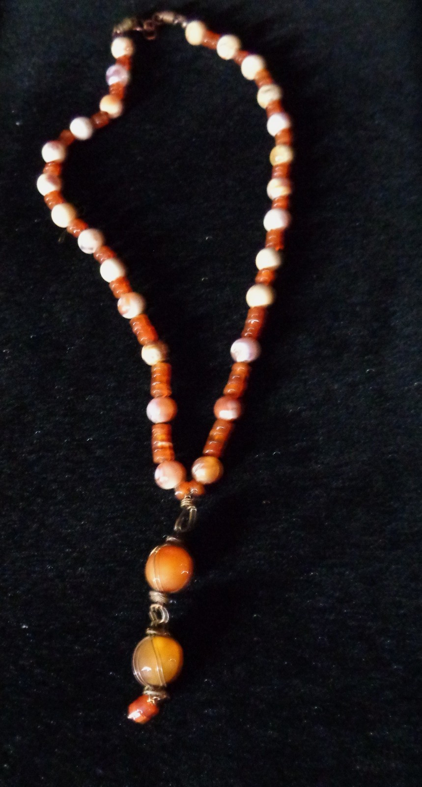 Artisan crafted,3” caged faceted red agate and carnelian pendant, on 18” hand kn