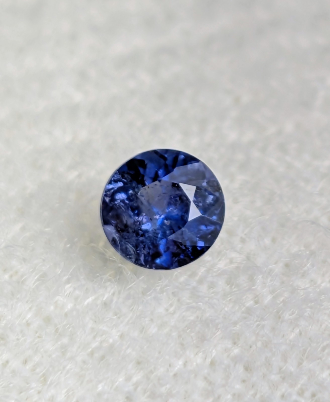 Benitoite: I, round gemstone 0.24 ct