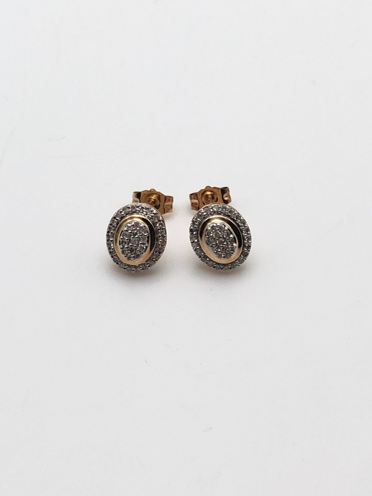 Oval Shaped 10k Yellow Gold Earrings with 0.20ctw of Diamonds 1.1 gram