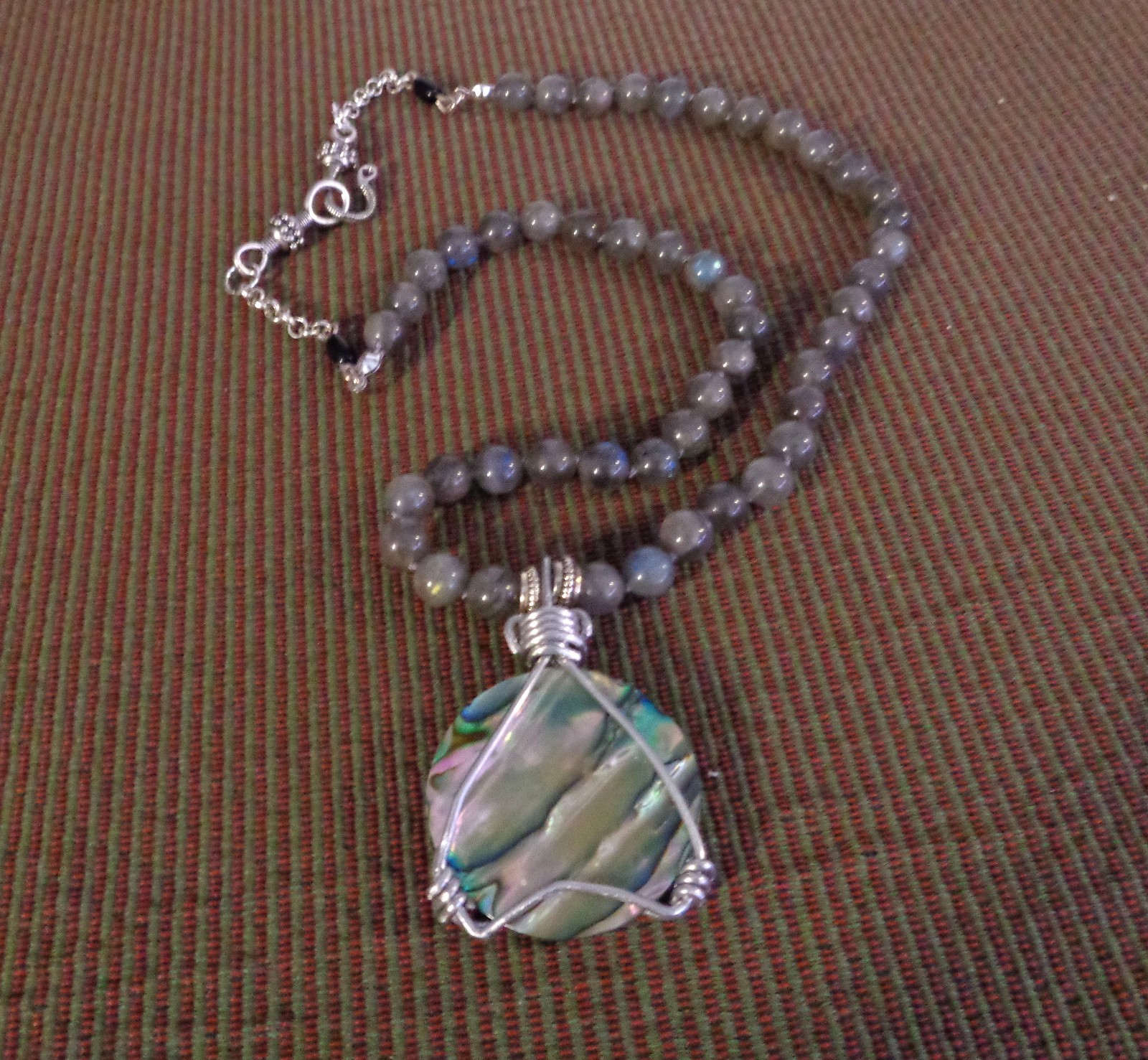Artisan crafted, gorgeous, aluminum wrapped Paua pendant, on 19” Labradorite str