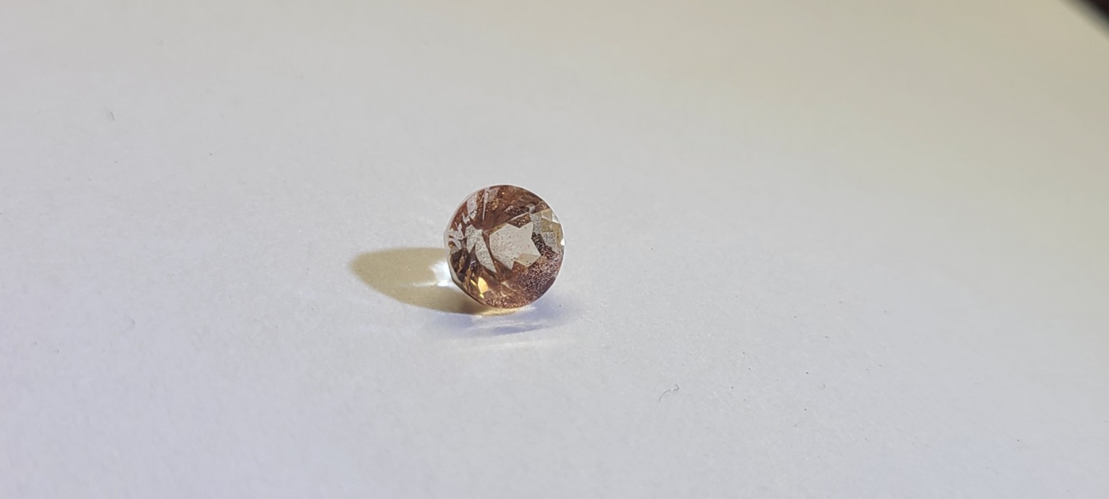 peach schiller faceted Oregon Sunstone 0.80 carat 5.4mm round found & cut in USA