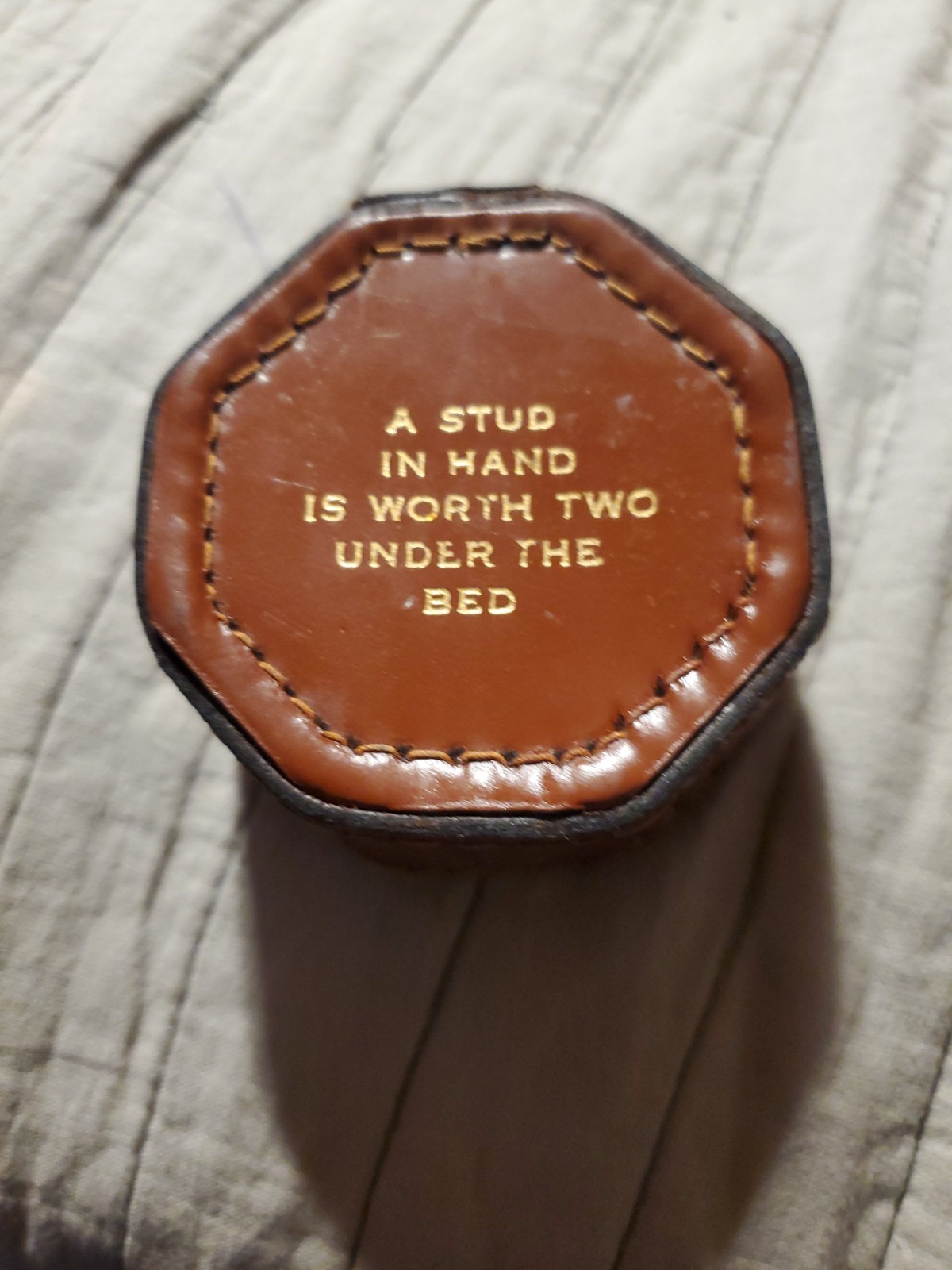 Cowhide cufflinks box made in England. Brown with beige stitching, gold letters