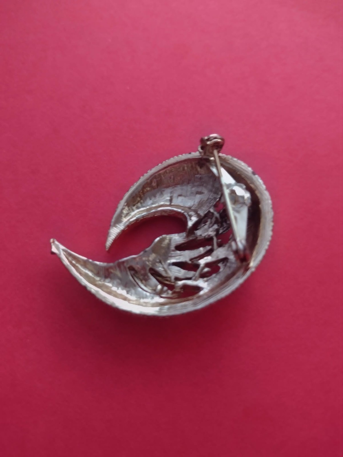 Golden feather brooch