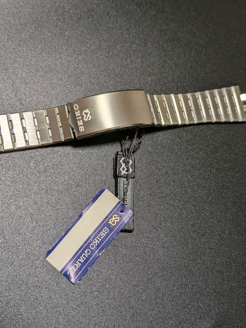 SEIKO stainless steel simple metal band with tag.