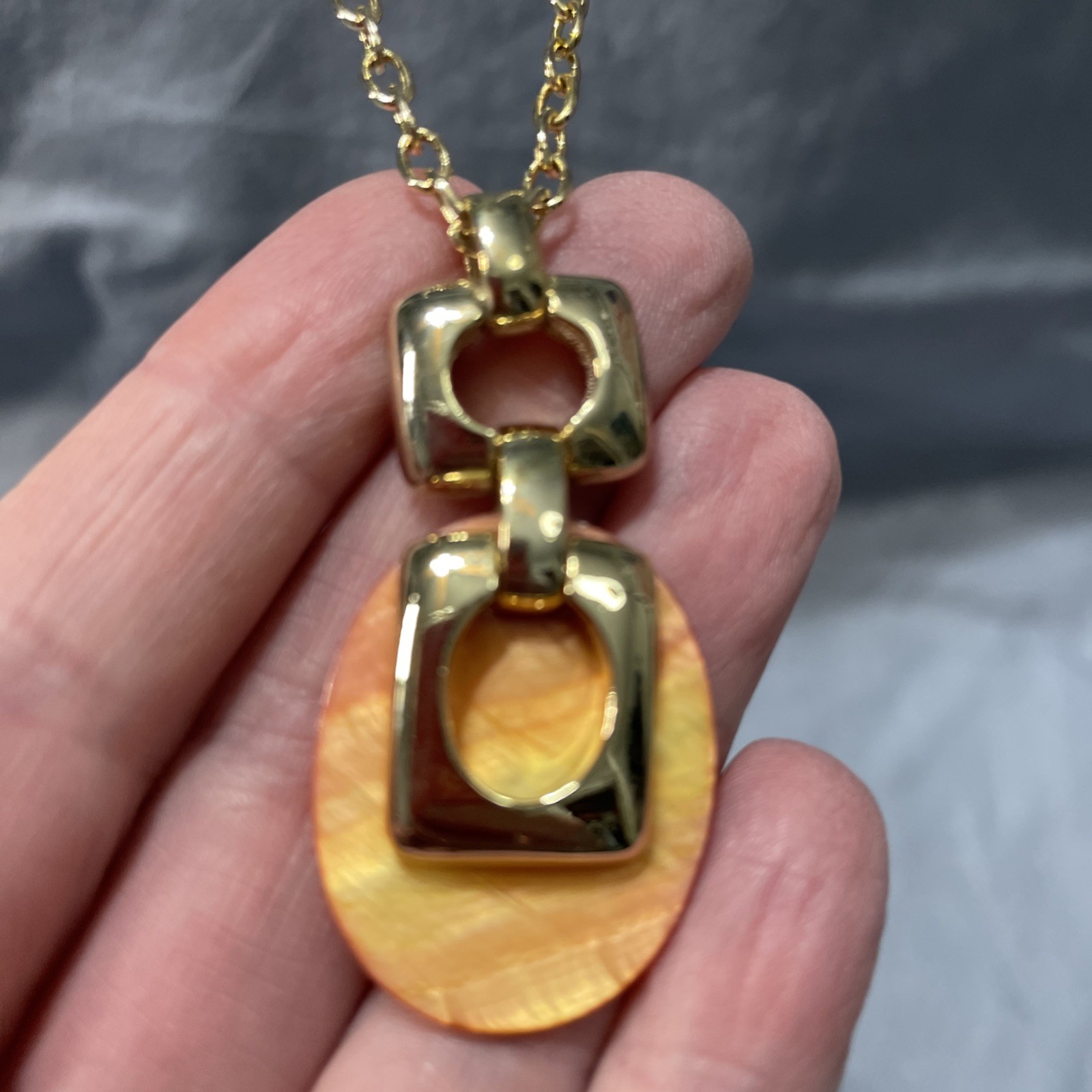 Orange And Good Pendant Necklace 10 Inches Long.