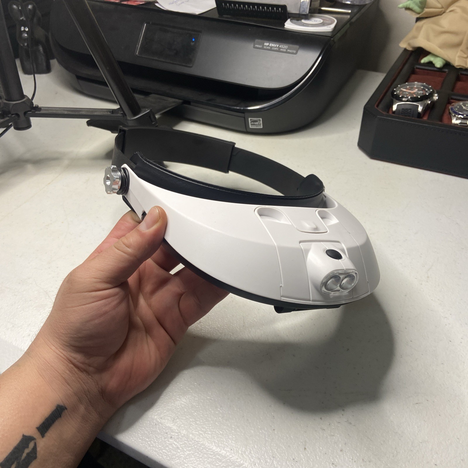 hands-free headband magnifier with a built-in LED light source.