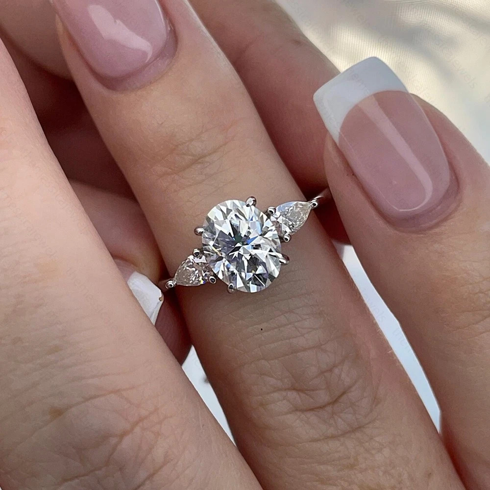 3.10 TCW Oval Cut Moissanite Three Stone Engagement Ring 14K White Gold Plated