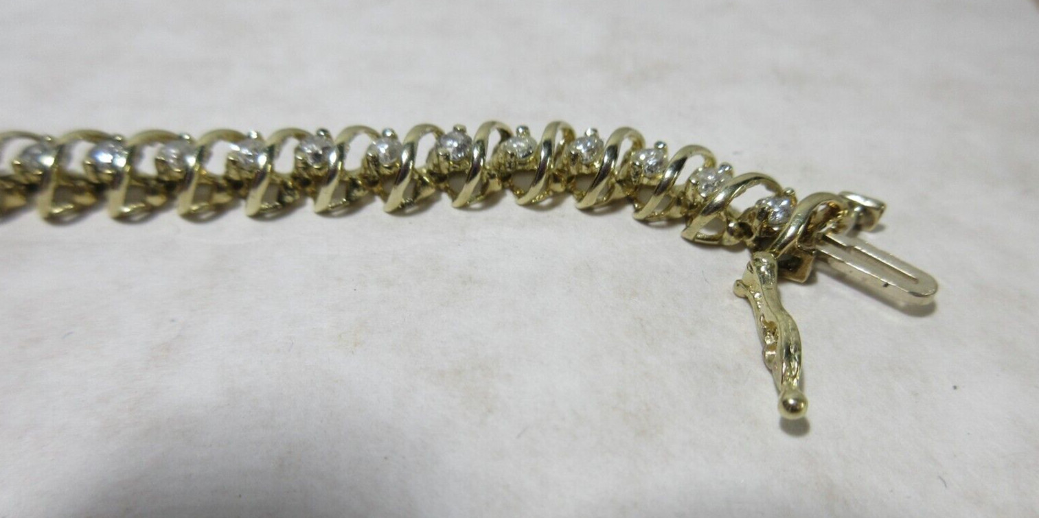 14K Yellow Gold tennis Bracelet, Wt 12.5g, locking 42 x 2.5mm diamonds si2 I1