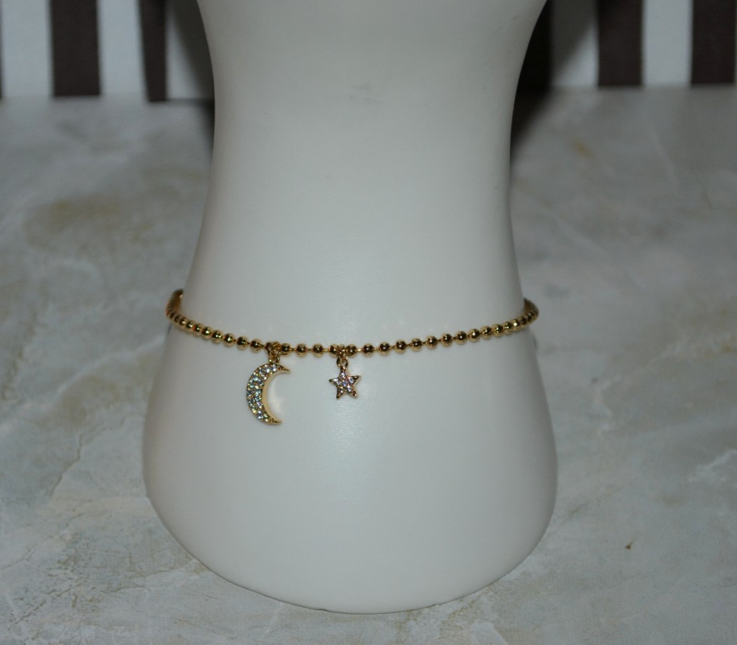 Henri Bendel Chain Bracelet with Star and Moon Charm