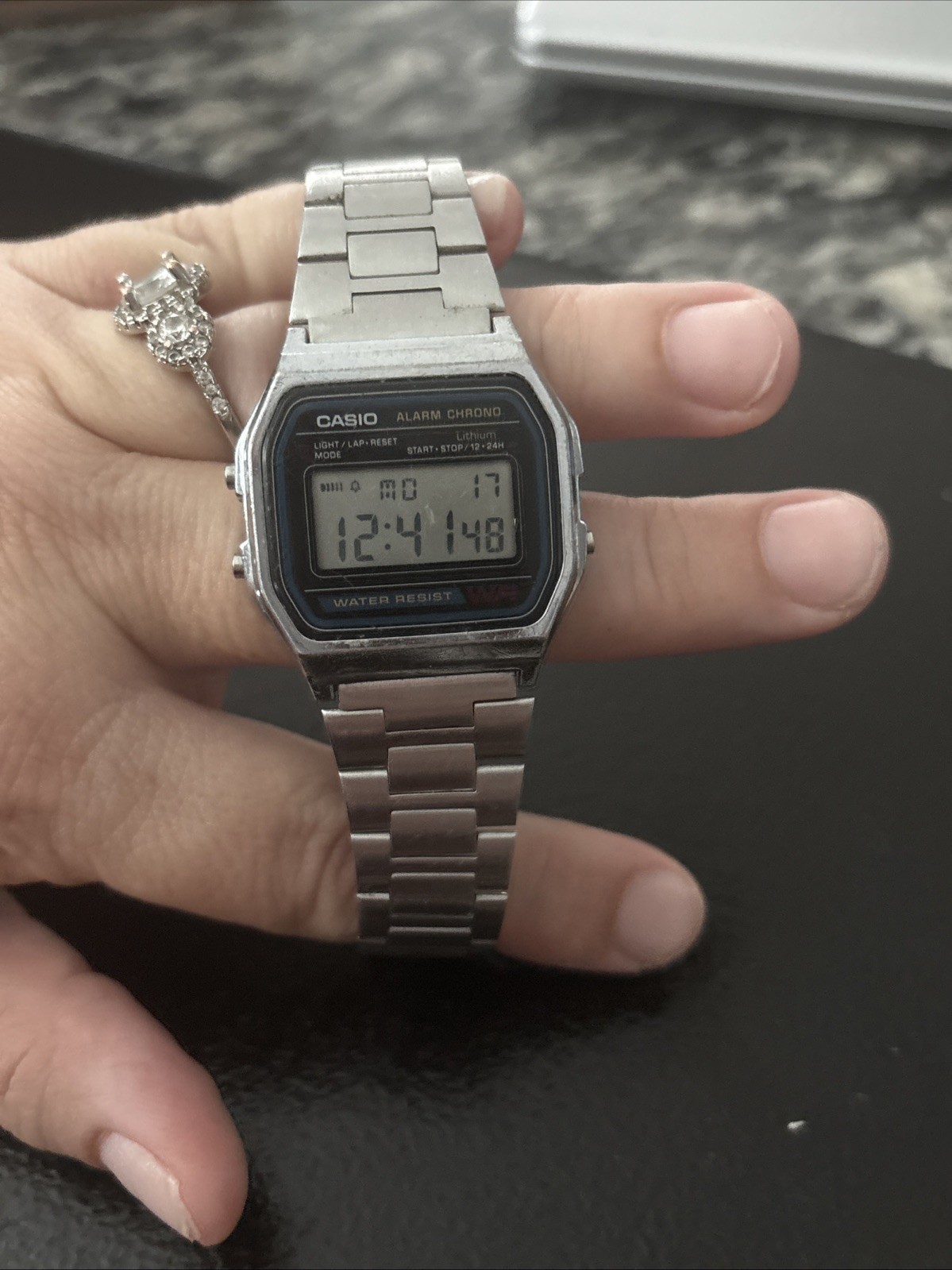 Vintage Casio A158WA-1 digital watch features a classic square face