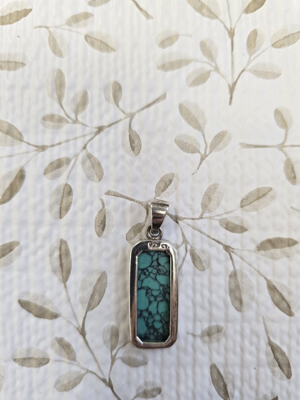 Sterling silver (925) turquoise pendant featuring a rectangular cabochon