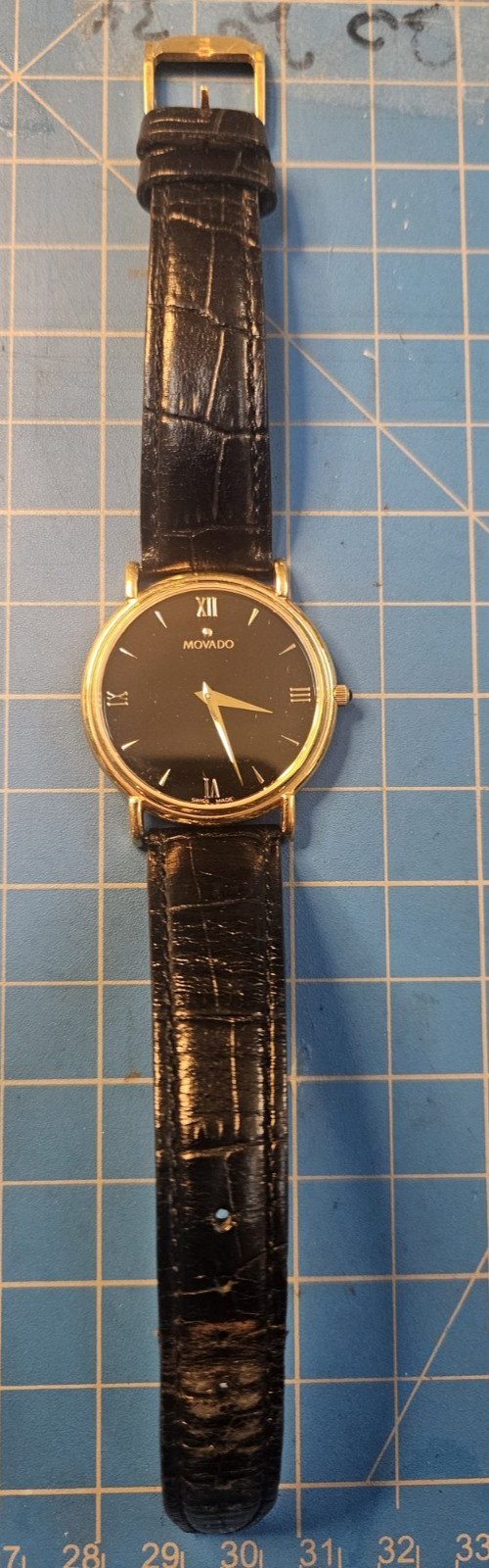Movado Classic Ultra-Thin Dress Watch – Ref. 87-E4-0885 – Gold / Black.