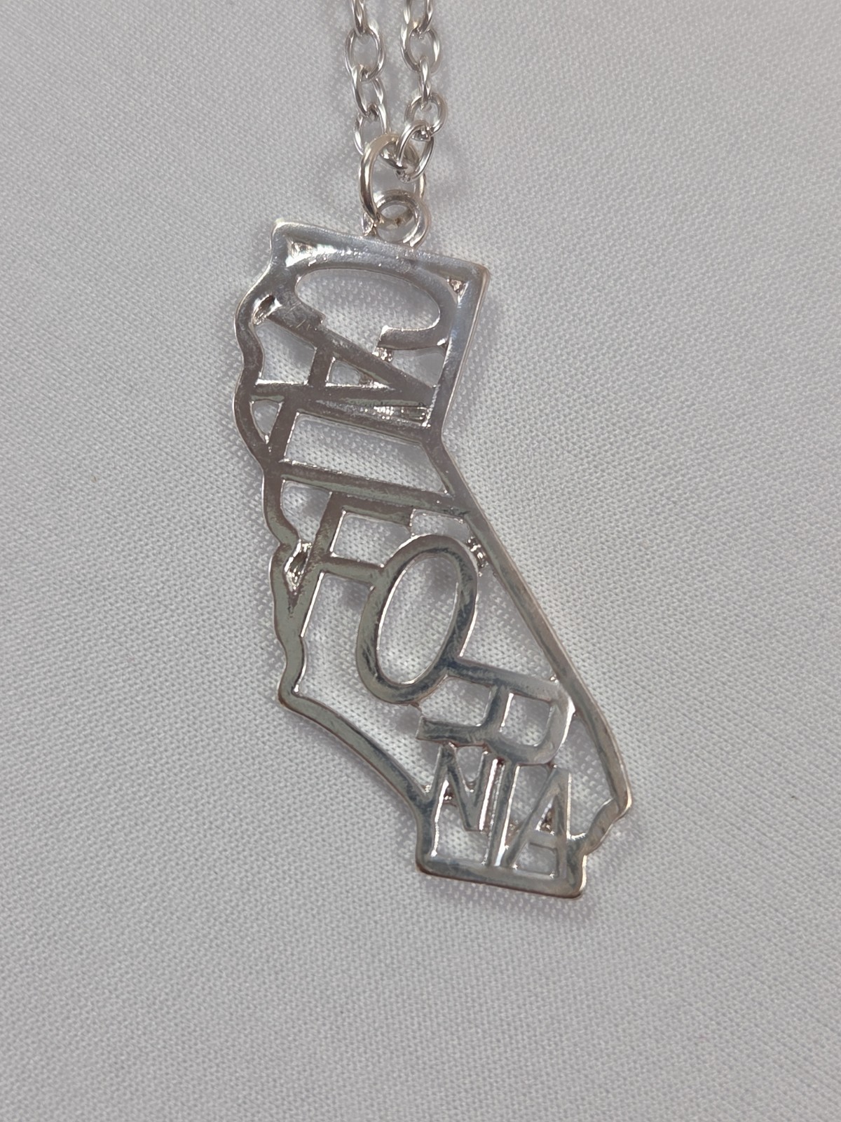 Dots Store Silver Tone California State Outline Spellout Statement Necklace NWT