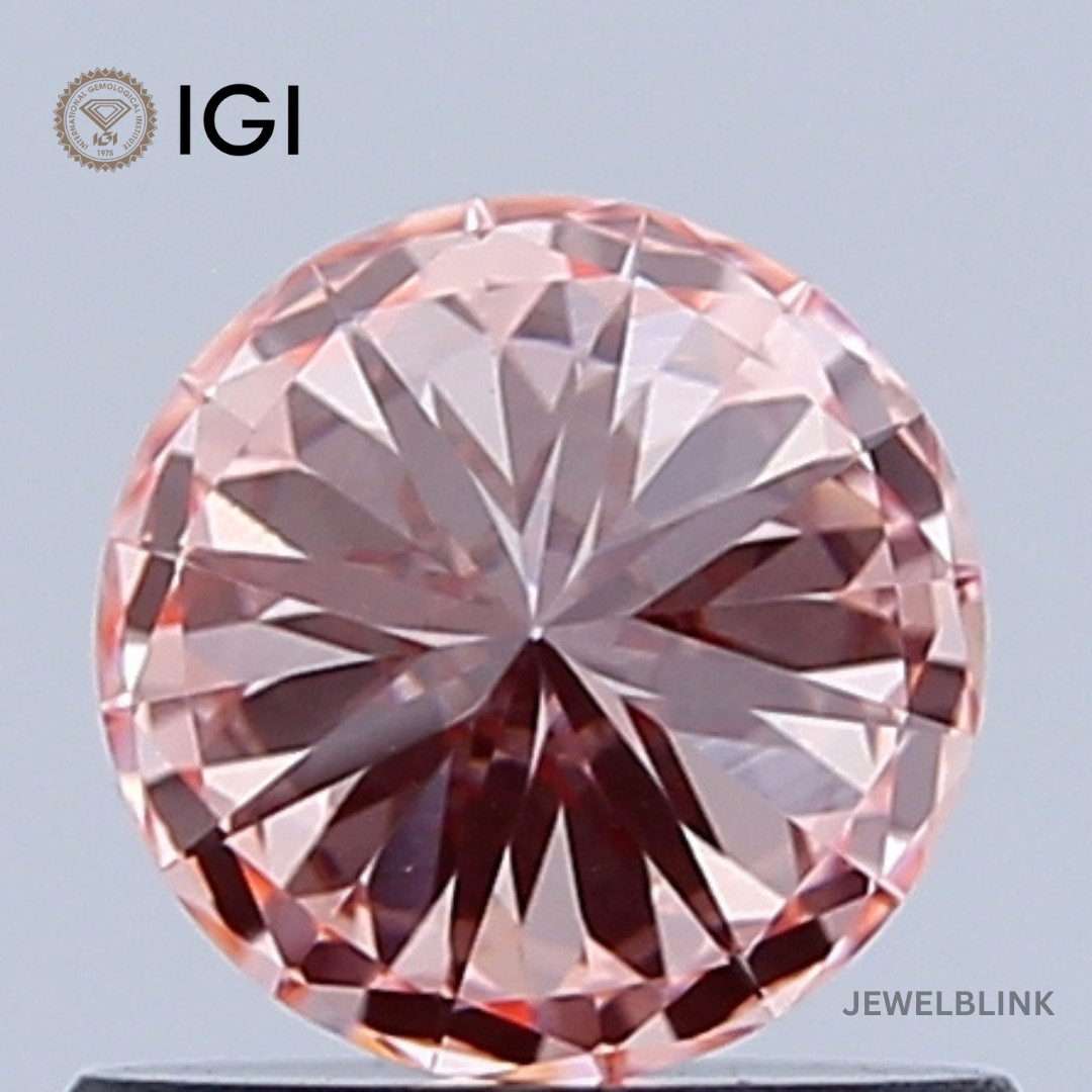 IGI Certified 0.66 CT VS1 Fancy Vivid Orangy Pink Round Cut Lab Grown Diamond