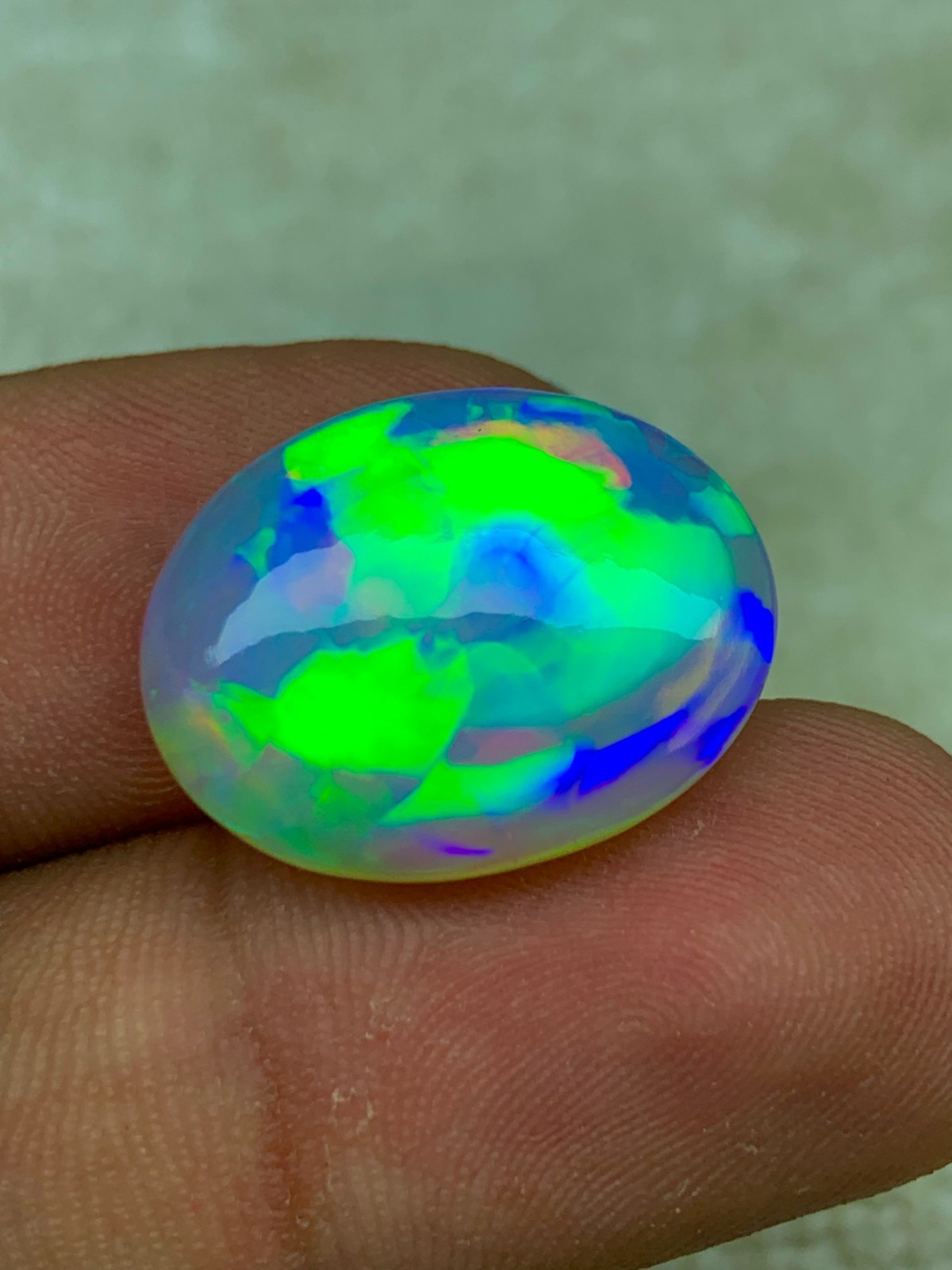 Natural Ethiopian Opal 8.30 Carat Oval Cabochon Rainbow Fire Welo Gemstone