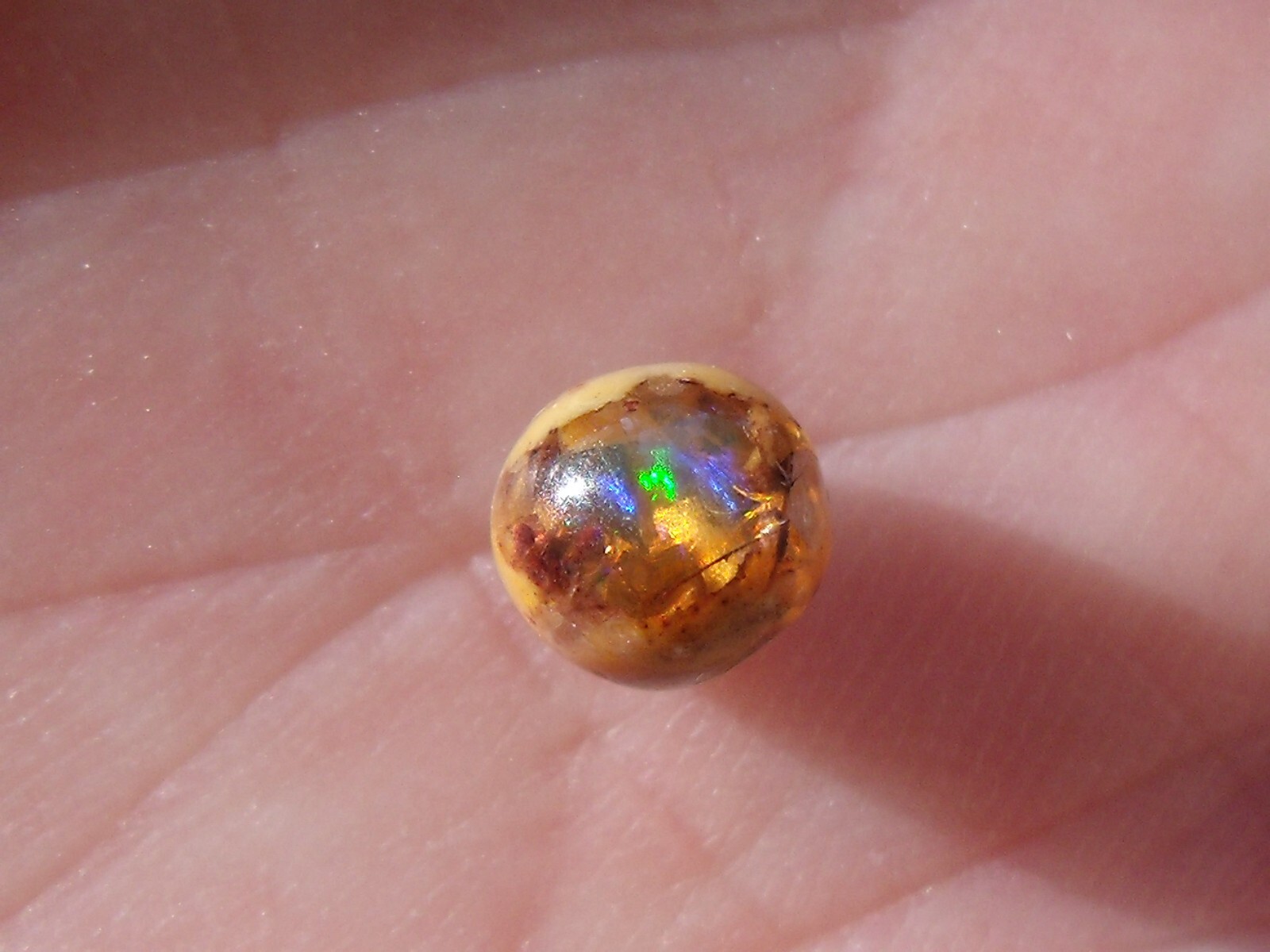 0.82 Ct. Round Cut Mexican Cantera fire opal bead.