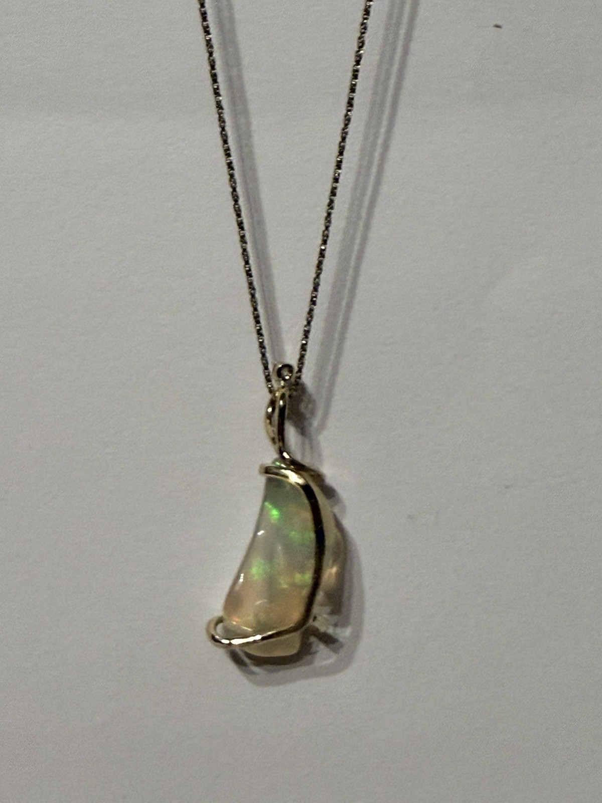 14k Solid Gold 4.90 carats opal and diamond pendant .
