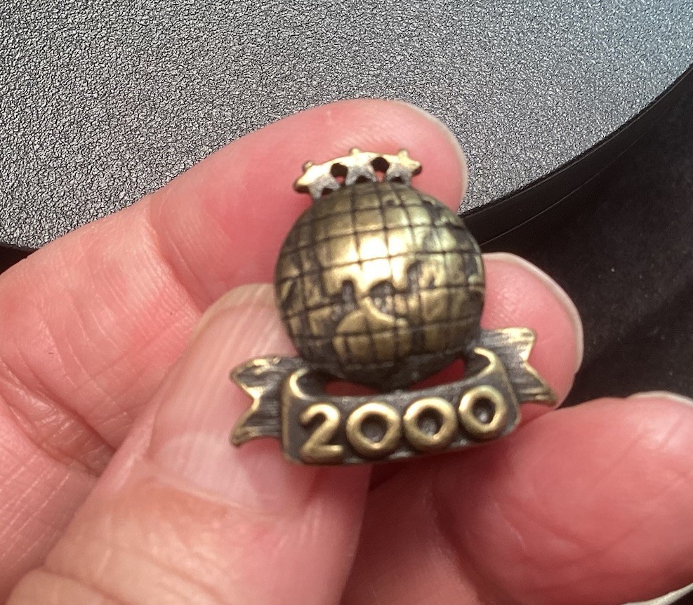 Black And Gold Tone 2000 World Lapel Hat Pin With Stars