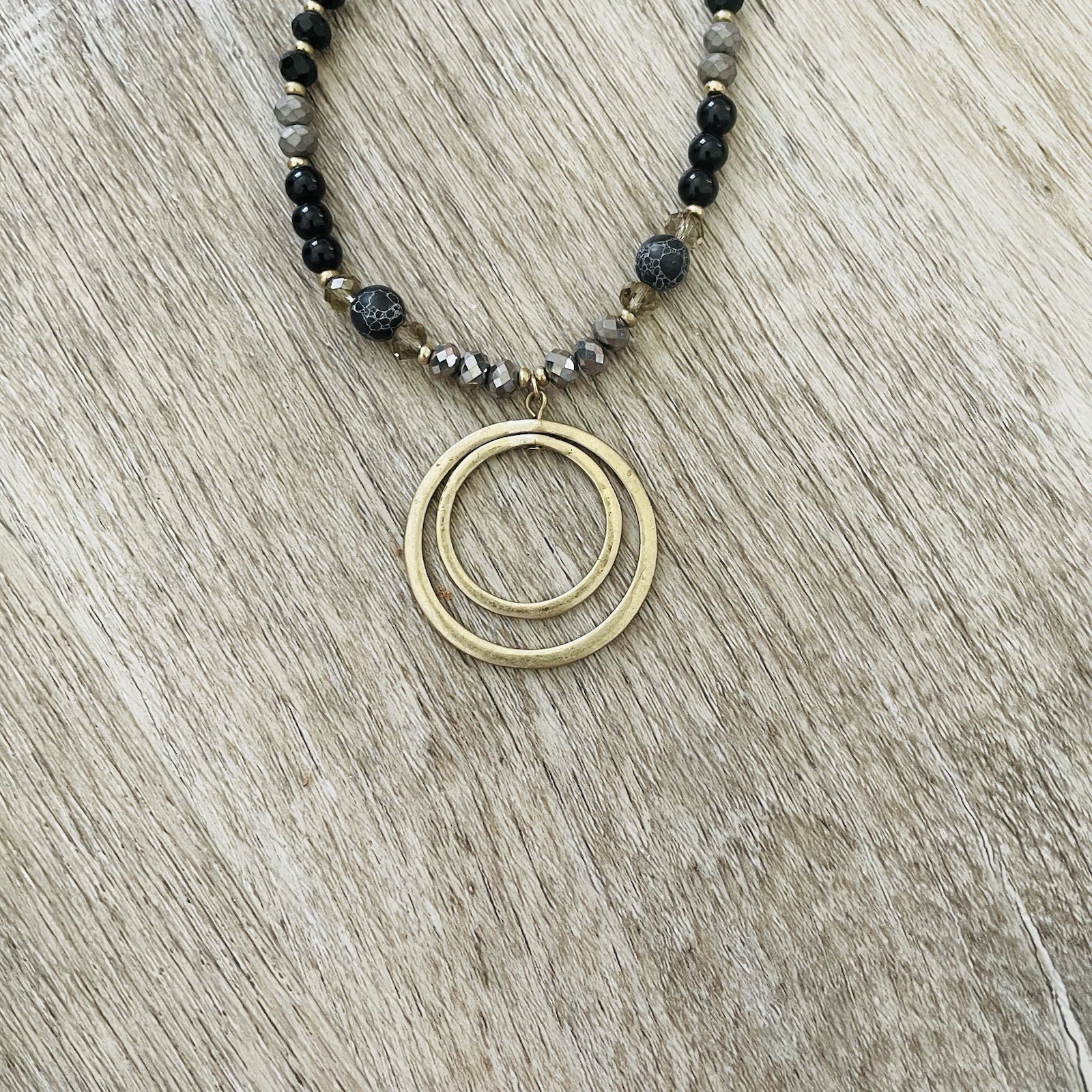 Gold Double Ring Pendant Necklace with Black and Gray Beads