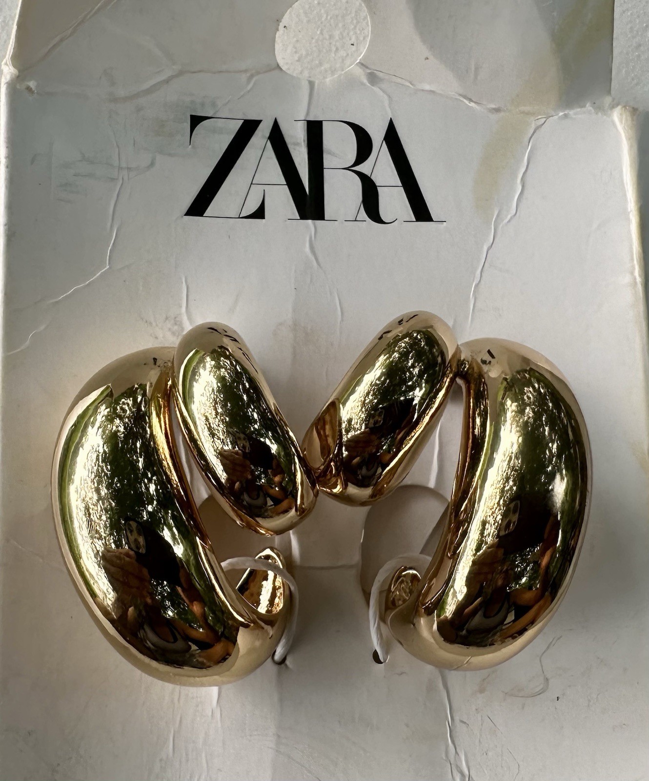 Zara Double Teardrop Earrings in gold.