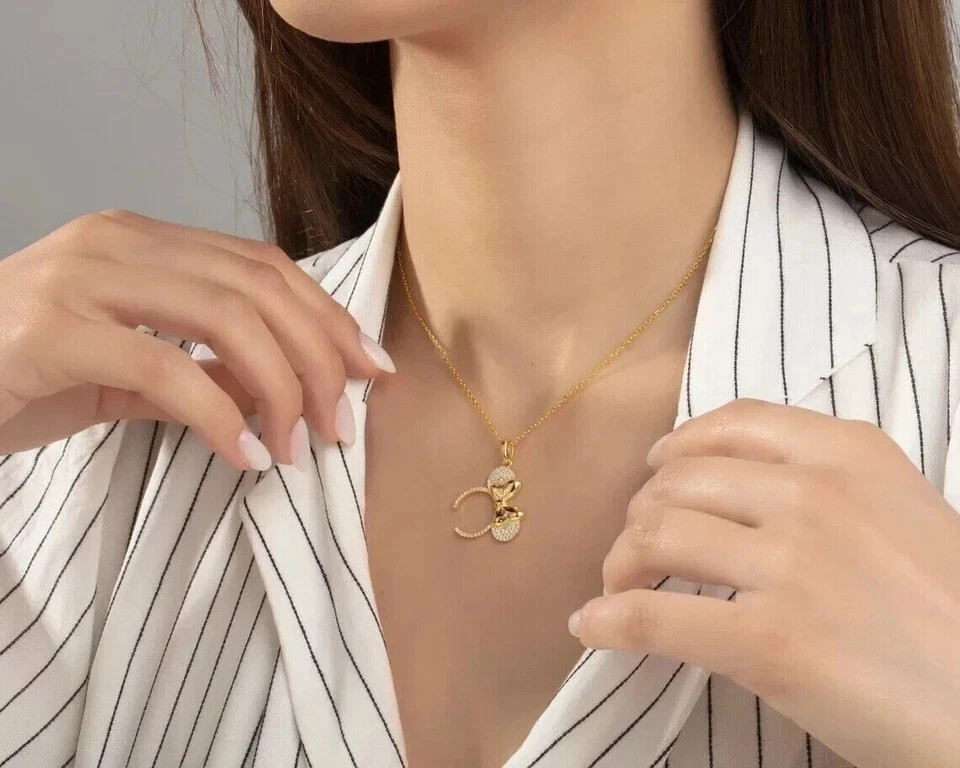 Sterling Silver Gold Finished -Tone Bow Pendant Necklace with Crystal Accents