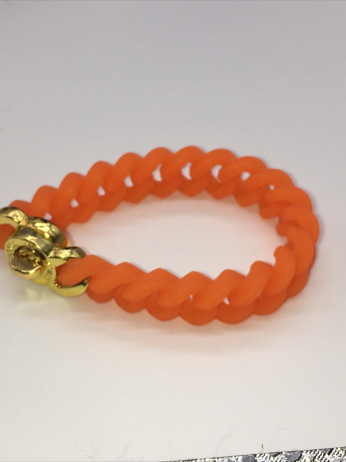 Rustic Cuff Gold Tone Logo Turn Lock Orange Silicone Stretch Mock Chain Bracelet