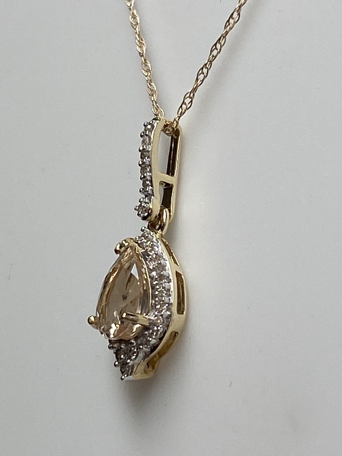 10K Yellow Gold Pear Shape Morganite and 0.11ct twt. Diamond Pendant with Chain