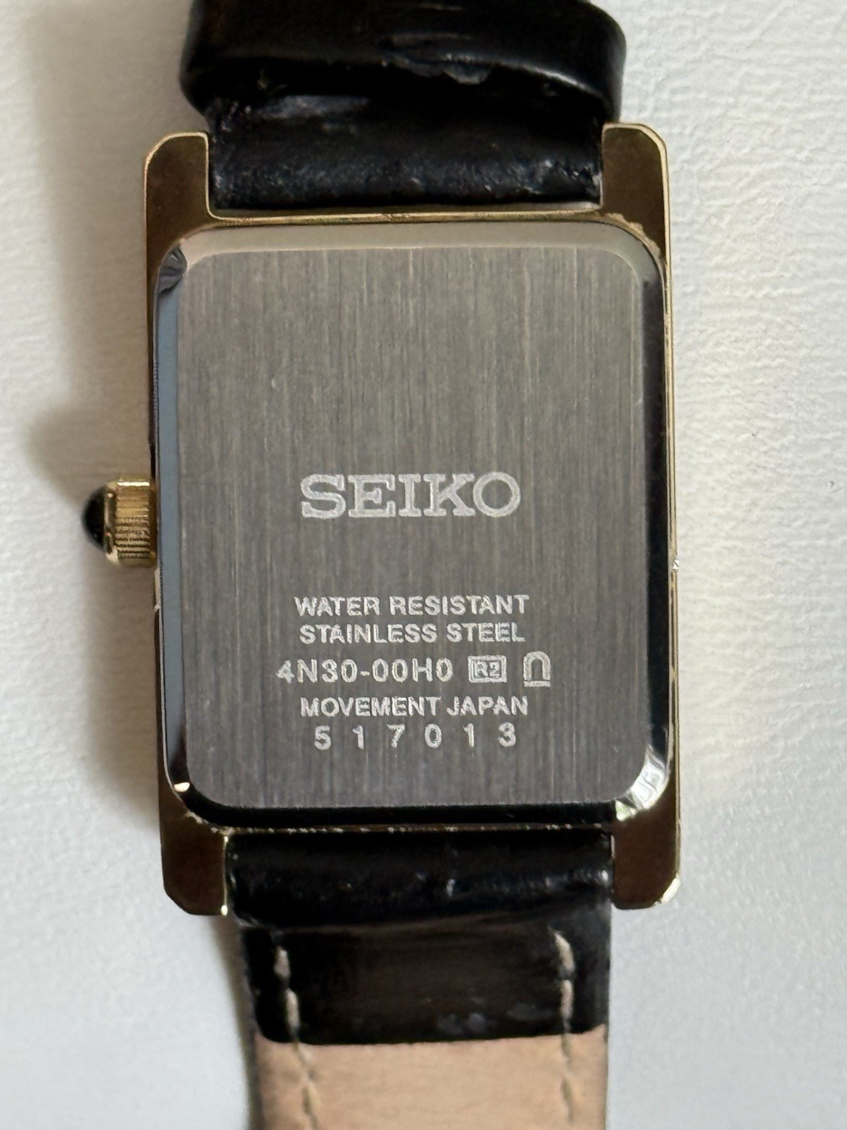 Vintage Seiko Women’s Quartz Tank Gold Tone White Roman Dial Black Leather Strap