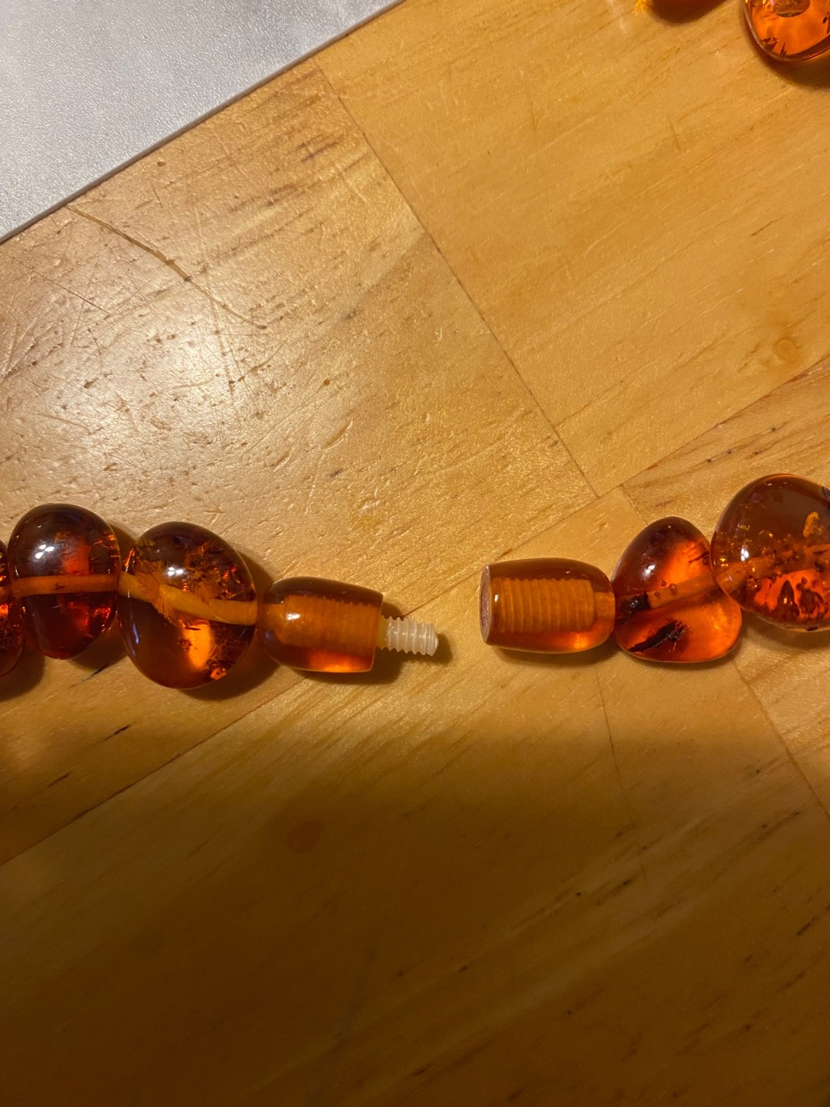 Braun amber necklace 21″ long with amber lock. New. Latvia.