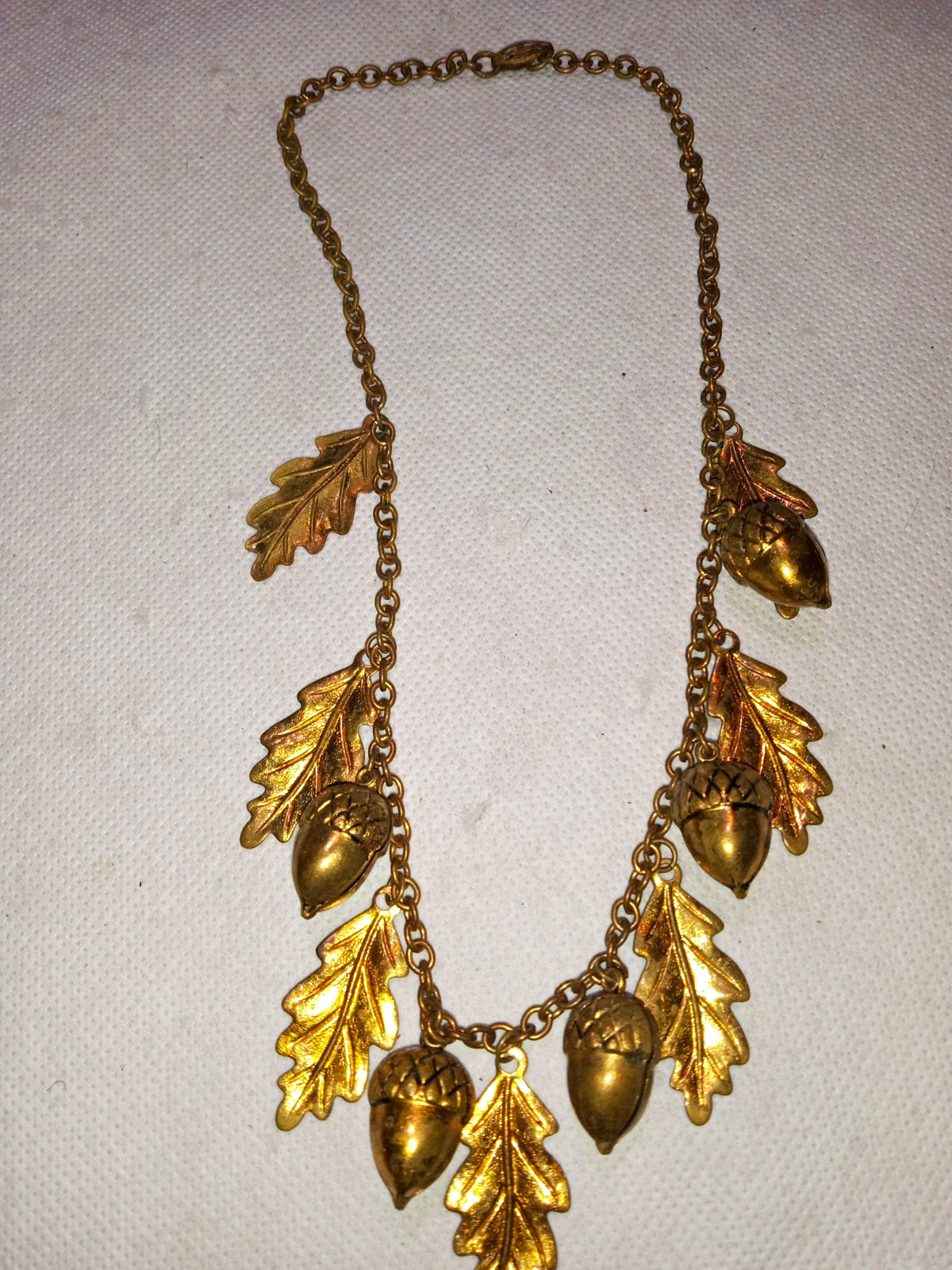 vintage Art Nouveau or mid-century style brass acorn and oak leaf fringe Bib