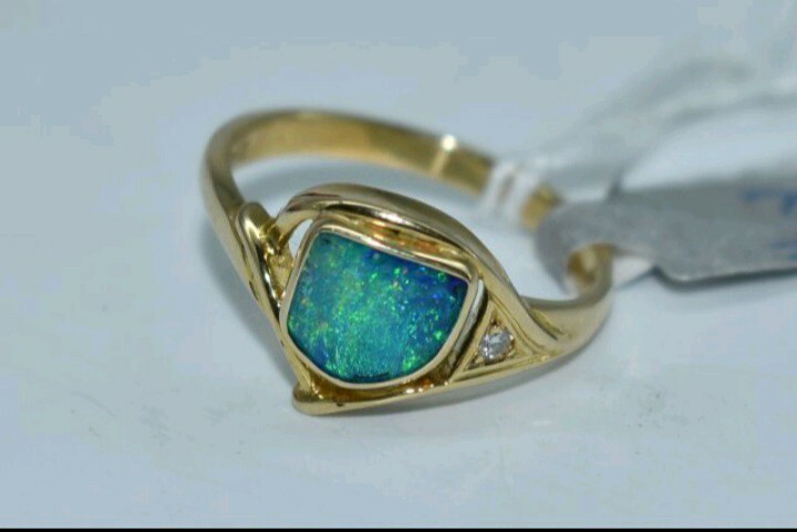 18k Gold Opal and Diamond Ring. Valuation certificate included.