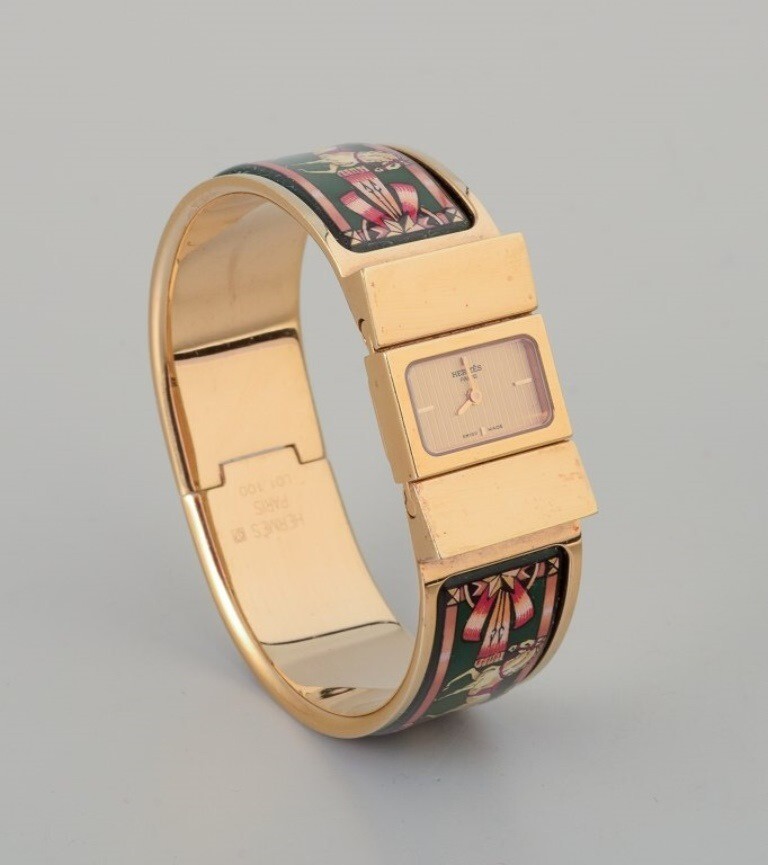 Hermes, ladies’ wristwatch. Made of gilded metal and enamel work.