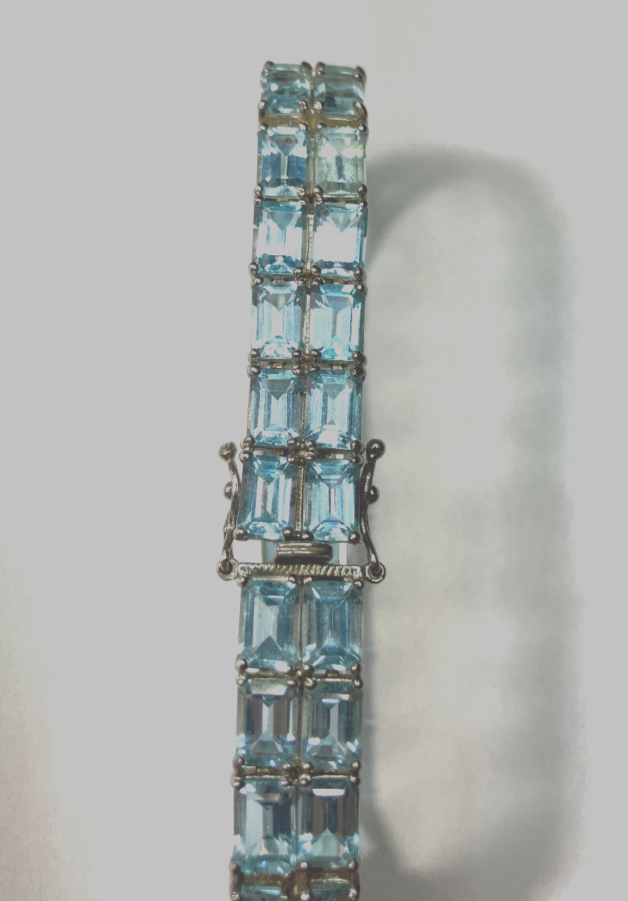8” TENNIS BRACELET -ADI 925 STERLING SILVER – 40 EMERALD CUT TOPAZ STONES -NICE!