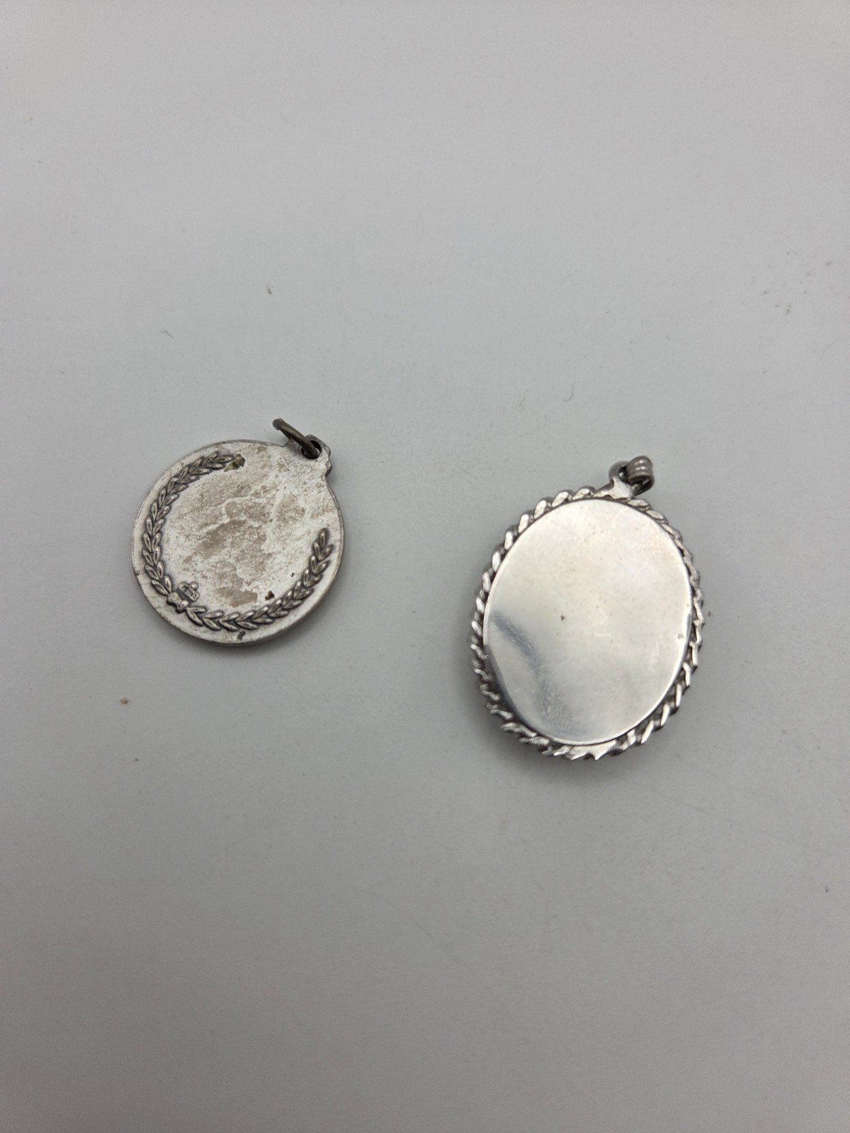 2 Silver Toned Pendants Olympic and One A Locket Vintage Jewelry