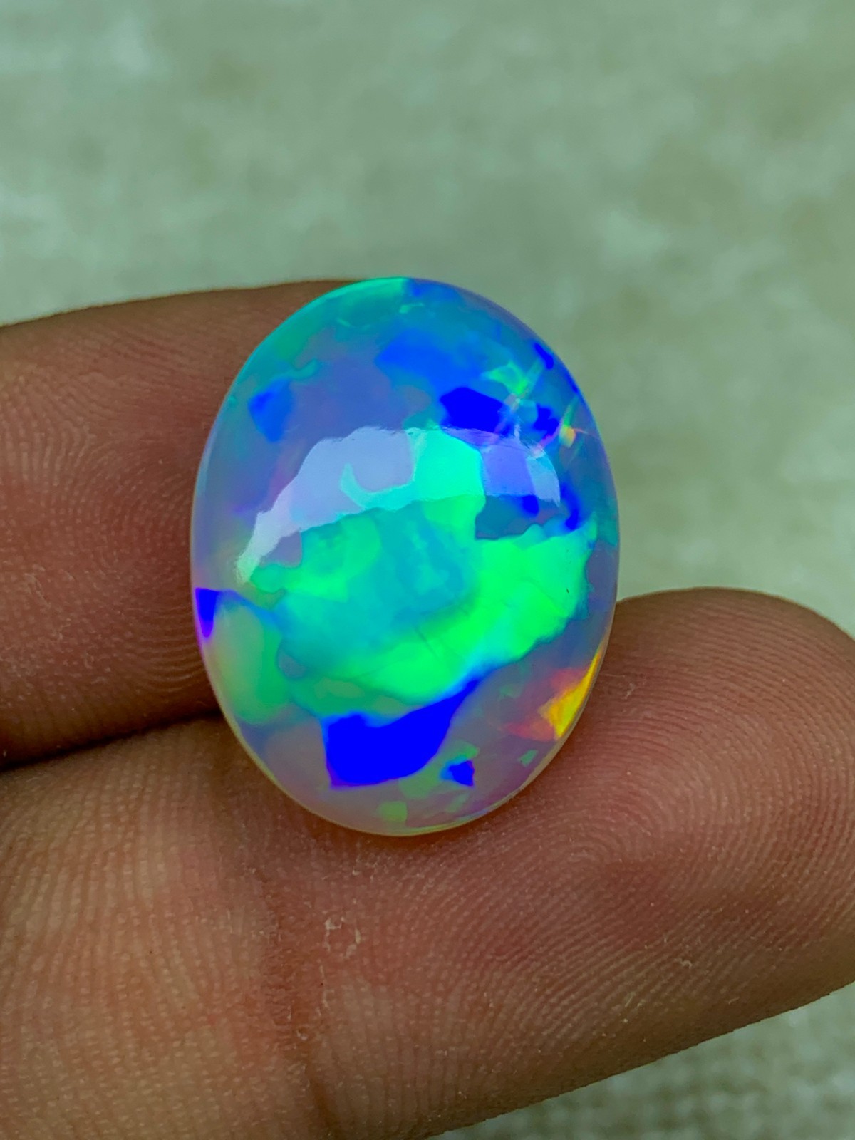 Natural Ethiopian Opal 8.30 Carat Oval Cabochon Rainbow Fire Welo Gemstone