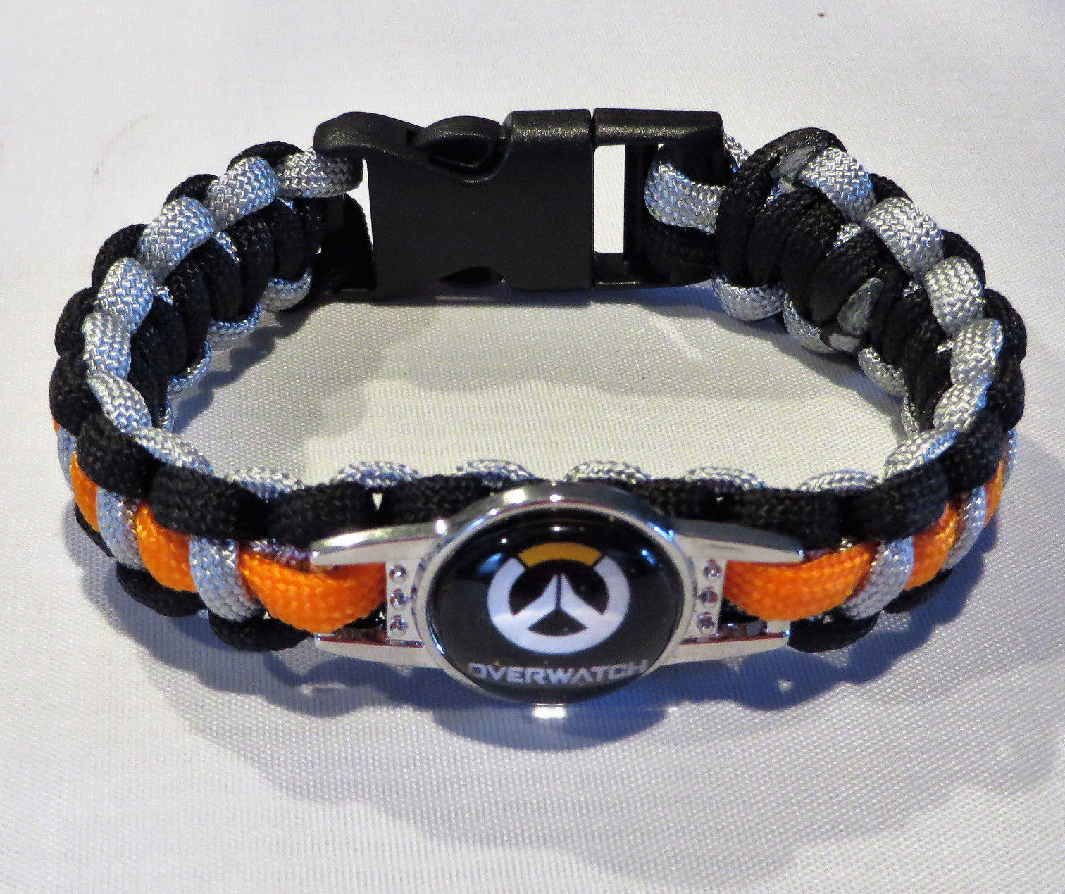 OVERWATCH LOGO POWERCORD 9″ ORANGE & BLACK SNAP ENCLOSURE UNISEX Bracelet