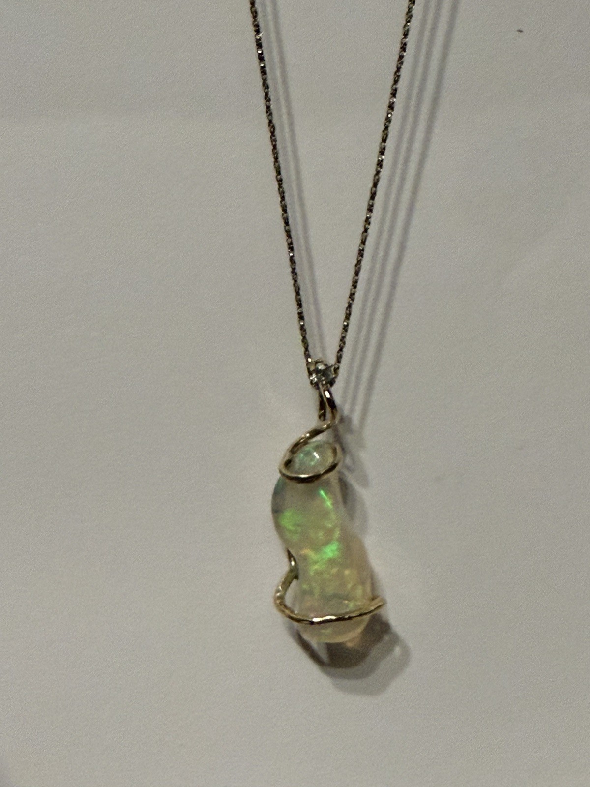 14k Solid Gold 4.90 carats opal and diamond pendant .