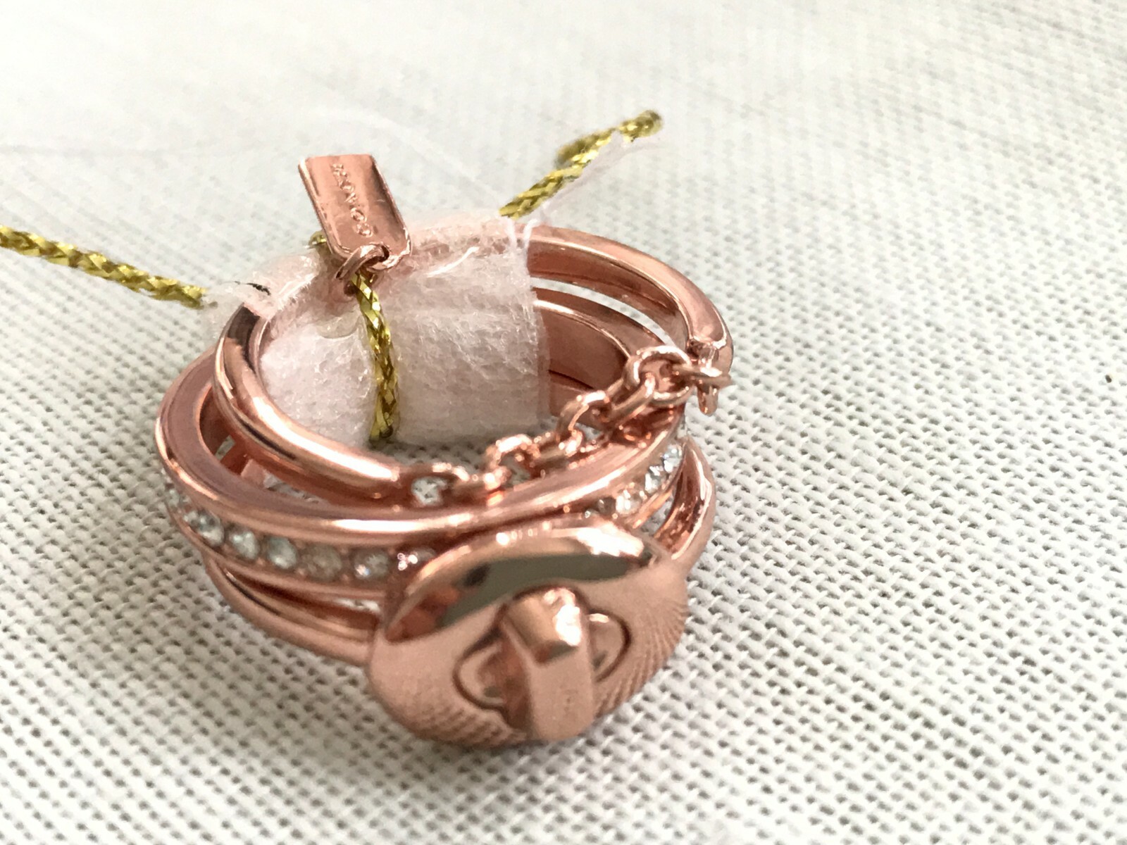 Coach pave turn-lock ring set