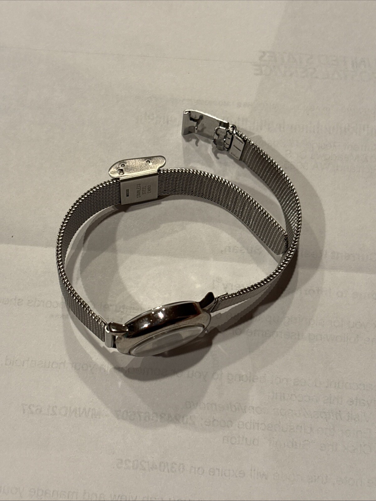 1996 GUESS numberless face watch. silver w adjustable mesh band. new battery.