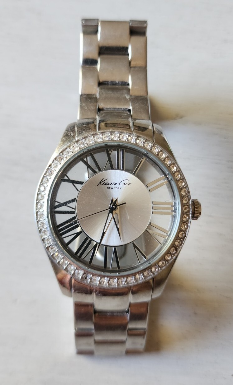 Kenneth Cole Women’s Watch Silver Tone Clear Transparent Round See-Through Dial