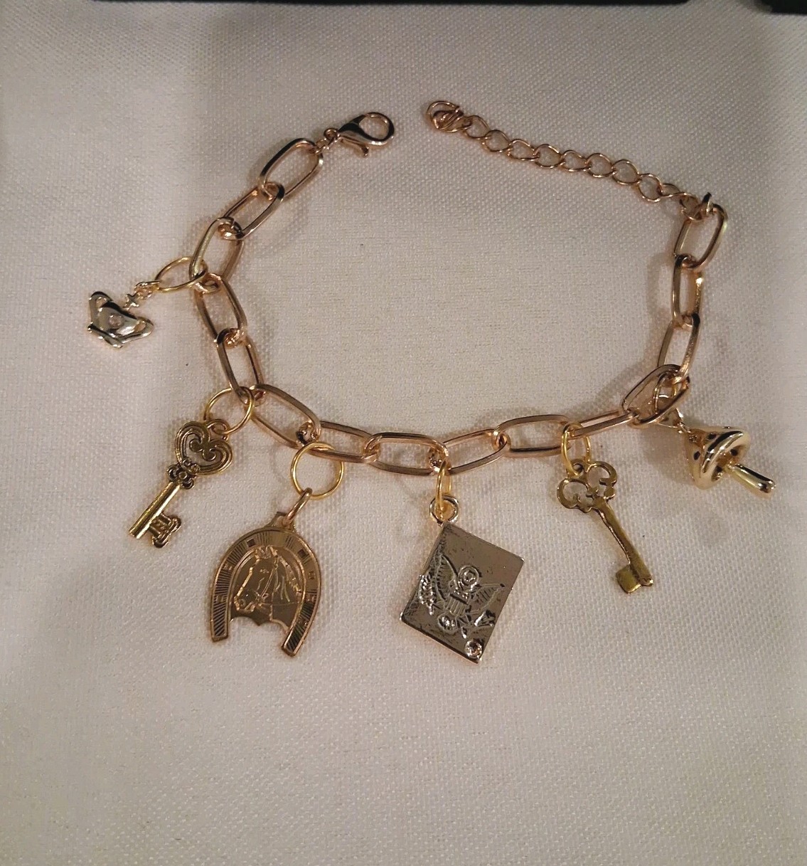 Goldtone Dangle Charm Bracelet, 6 Charms:Horse,Crown,Keys,Mushroom& Amer. Eagle