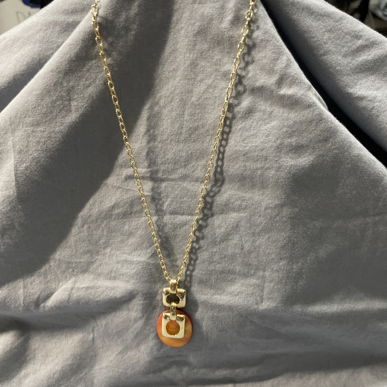 Orange And Good Pendant Necklace 10 Inches Long.