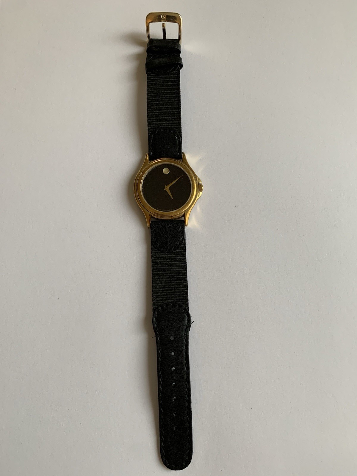 Movado Swiss made Sapphire Crystal Quartz Watch. Working-needs battery