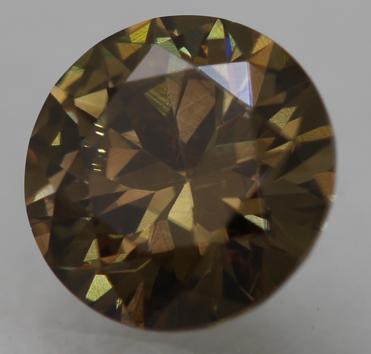 Cert 0.59 Carat Yellow Brown VVS1 Round Brilliant Natural Enhanced Diamond 5.51m