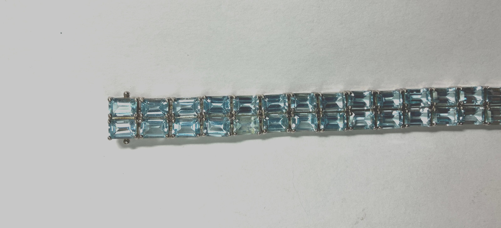 8” TENNIS BRACELET -ADI 925 STERLING SILVER – 40 EMERALD CUT TOPAZ STONES -NICE!