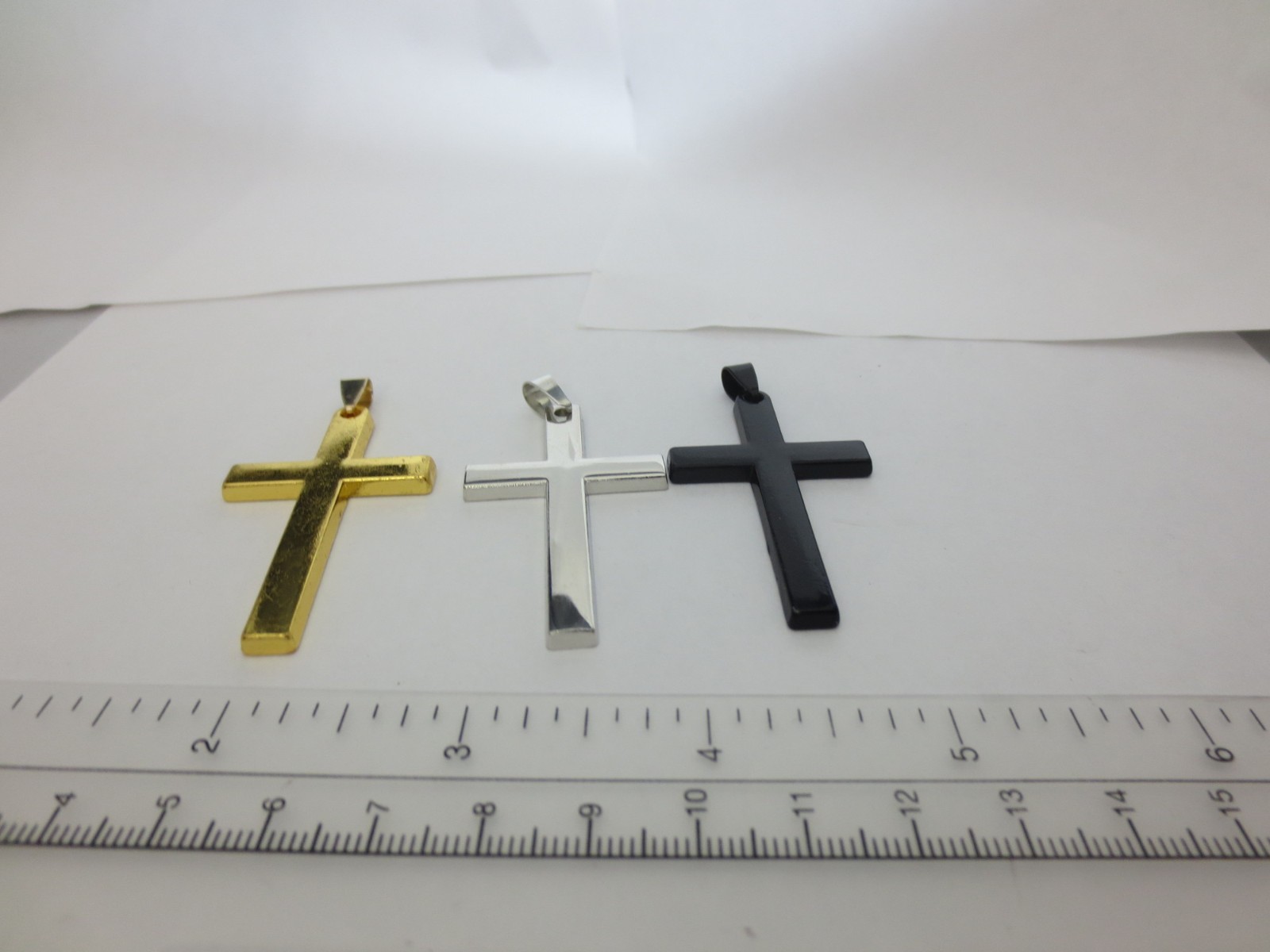 GOLD/SILVER/BLACK STAINLESS STEEL CROSS ALMOST 2 1/4″ HIGH BY 1 1/4″ WIDE P15